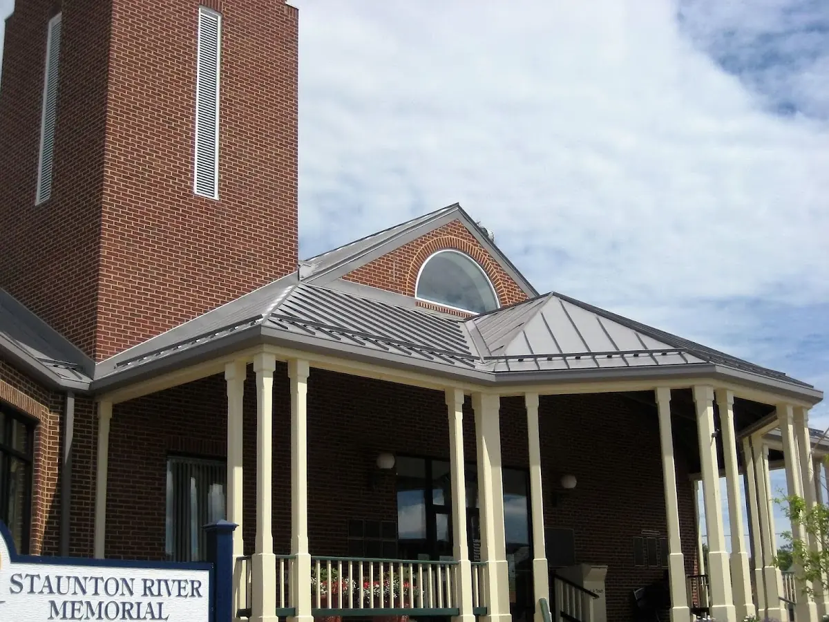 Skilled roofing craftsmen working on a residential roof in Candler